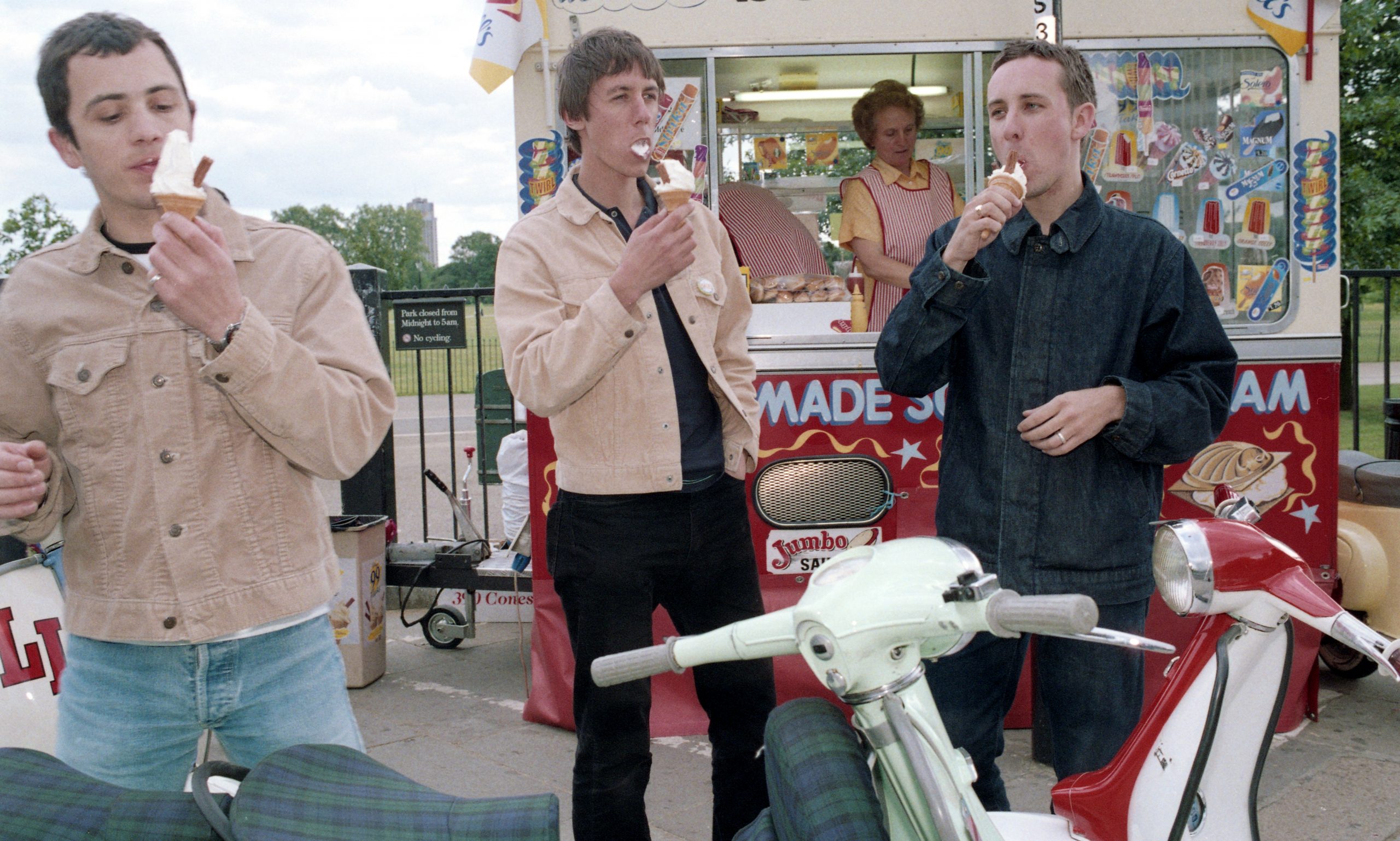 RebeccaLewis-mod-fast-food A group of mods eating ice cream next to scooters, London, UK, 1999 by Rebecca Lewis