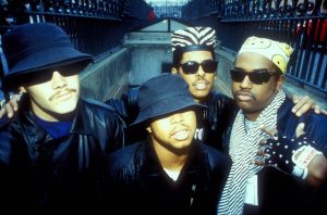 Digital Underground wearing fishing hats and bandanas coming up stairs, U.S.A, 1980s.