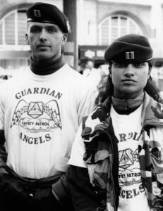 Two members of the Guardian Angels Safety patrol outside the London Underground station, London, UK, 1990s